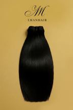 Black hair bundle on a beige background with 'I.MANHAIR' branding.

